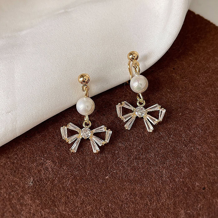 Bow Perlen Ohrclips mit Zirkonia