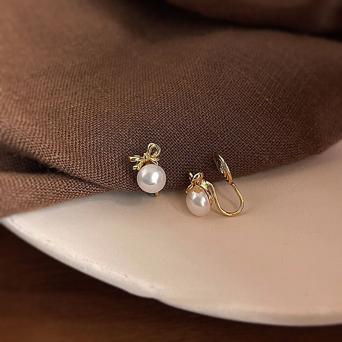 Gold Bow Ohrclips mit Perlen