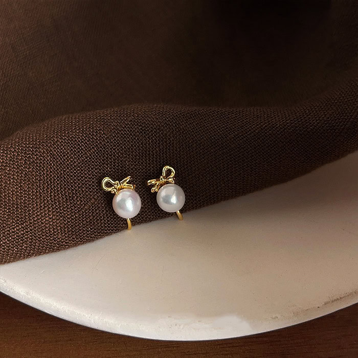 Gold Bow Ohrclips mit Perlen