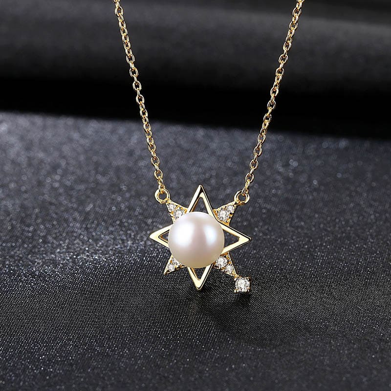 Goldene Saturn Kette mit Perle