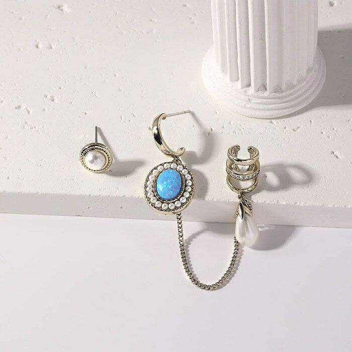 Asymmetrische Ohrringe Vergoldet mit Opal