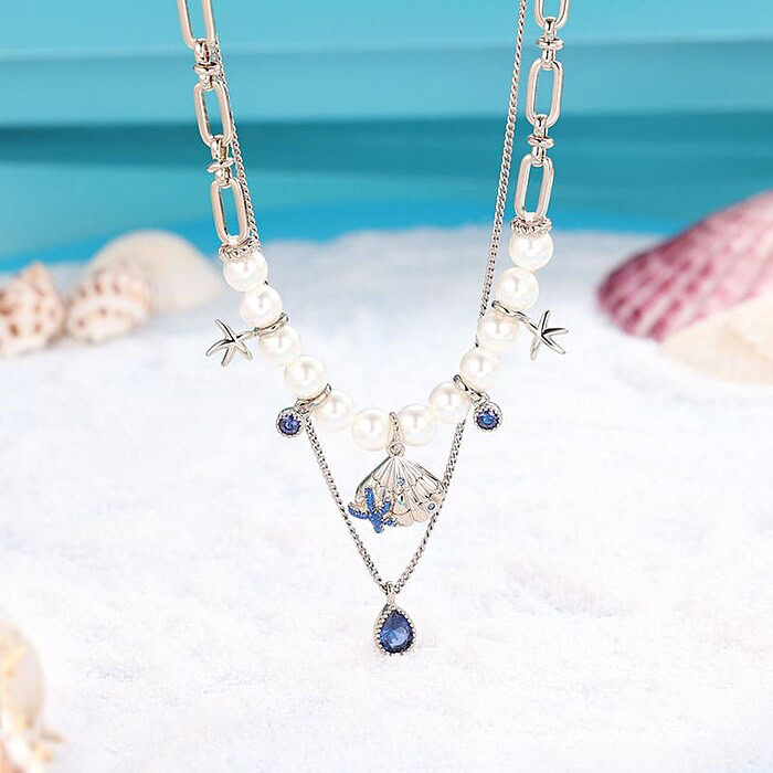 Layering Kette mit Muschel und Perlen